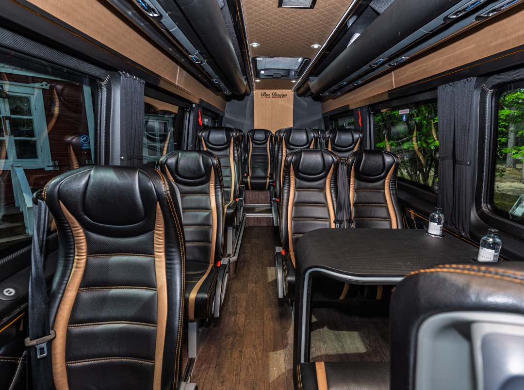 Inside the 16-seat van: comfortable leather seats and a table for the group.